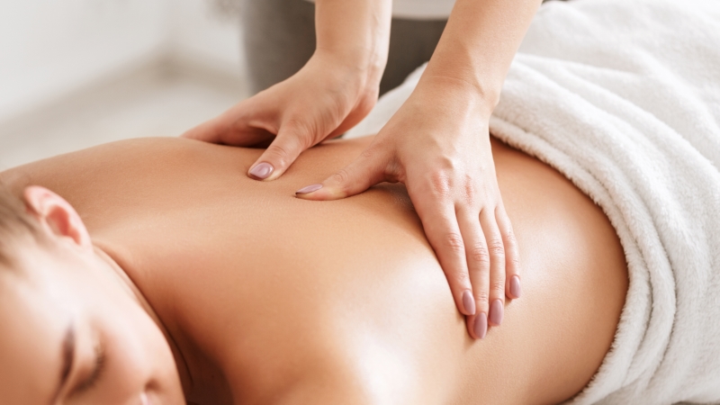 A woman getting her back massaged